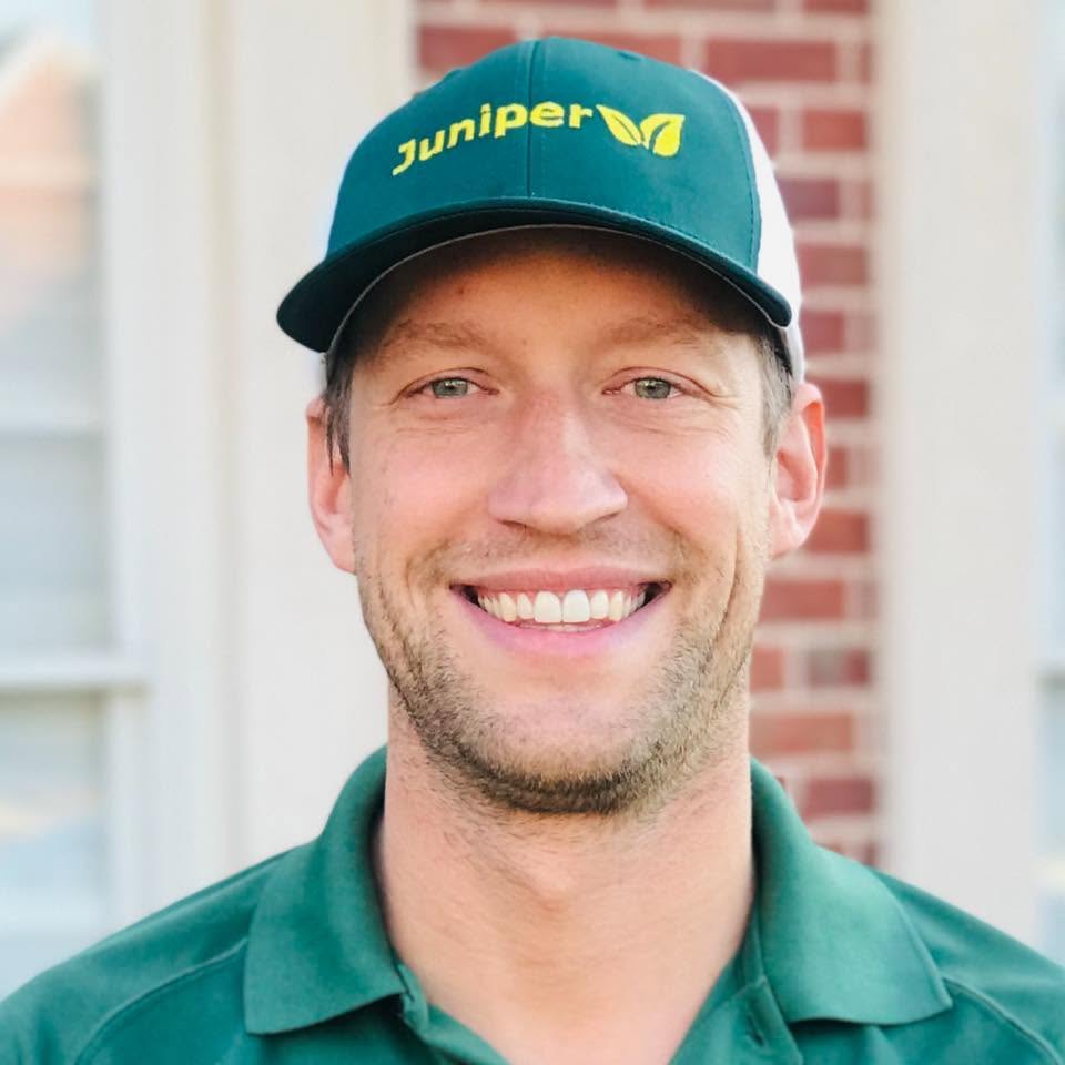 Mike Hannan wearing a Juniper cap